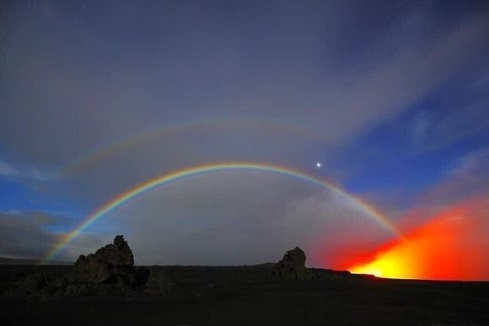Kilauea erupting double moonbow.jpg